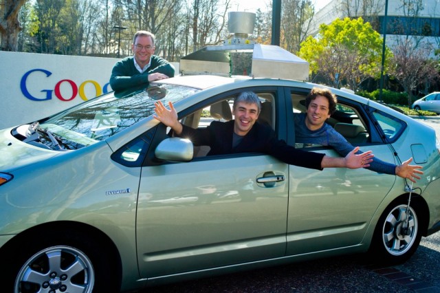 Eric Schmidt, Larry Page, and Sergey Brin with a self-driving car in January 2011