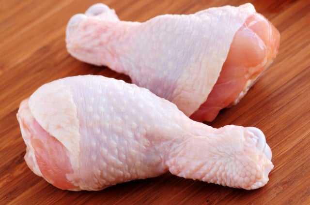 Raw chicken legs on a table