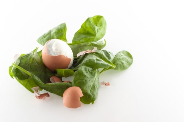 Cracked egg on Spinach
