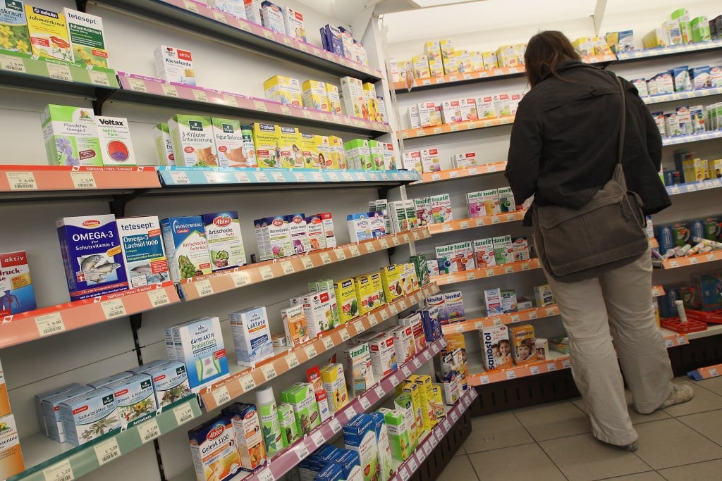 A woman shops at a pharmacy