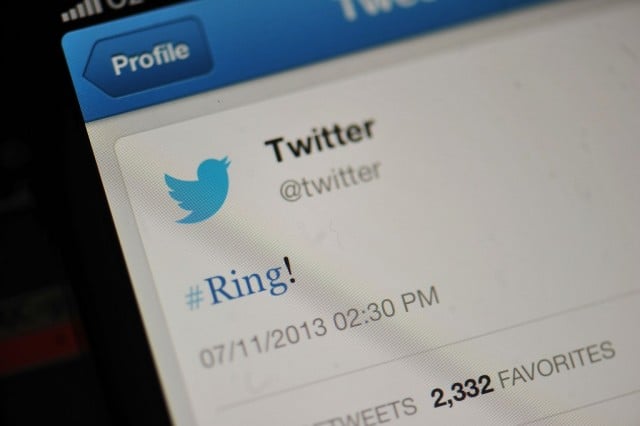 The Twitter logo and hashtag '#Ring!' is displayed on a mobile device as the company announced its initial public offering and debut on the New York Stock Exchange on November 7, 2013