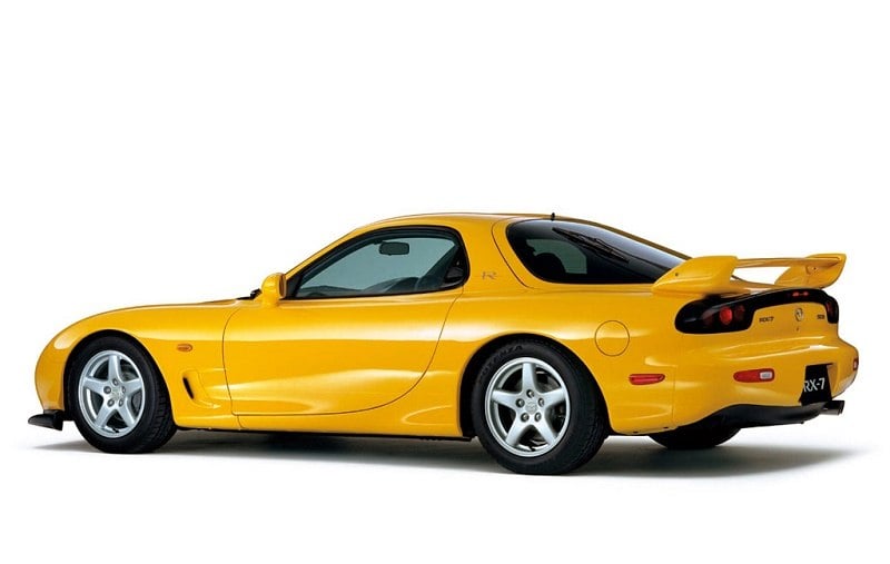A yellow 2001 Mazda RX-7 Type-R