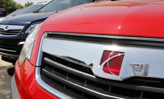 Saturn logo on the front bumper of a car.