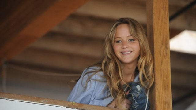 Jennifer Lawrence leans on a post and looks over a railing in Like Crazy