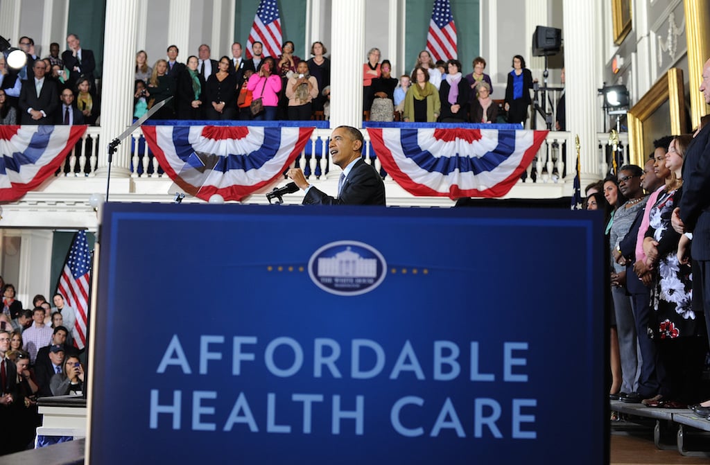 US President Barack Obama speaks on healthcare at Faneuil Hall in Boston, Massachusetts, on October 30, 2013. Obama arrived in Boston to speak on the importance of providing all Americans with quality, affordable health insurance and the experience in Massachusetts, which passed its bipartisan health care law in 2006. Photo by Jewel Samad/AFP/Getty Images