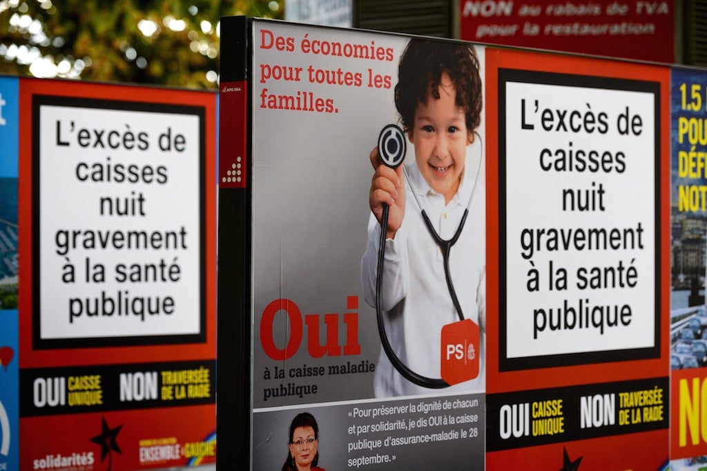 Campaign posters promoting a single health insurance public system are seen on September 21, 2014 in Geneva. The Swiss will head to the polls on September 28, 2014 to vote on whether or not they want to do away with a system often hailed abroad as efficient but a source of growing frustration at home, amid soaring healthcare costs. Photo by Fabrice Coffrini/AFP/Getty Images.