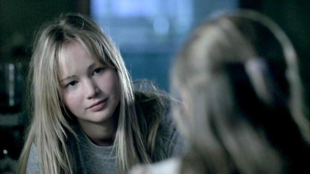 JenniferLawrence looks at a younger girl in The Poker House