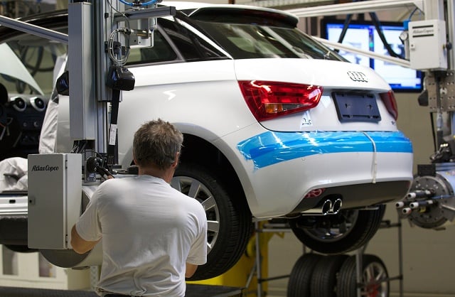 A car mechanic works on the production l