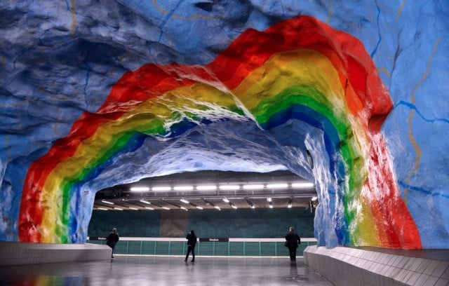 People walk at the Stadion subway station on November 6, 2012 in Stockholm. Over 90 of the 100 subway stations in Stockholm have been decorated with sculptures, mosaics, paintings, installations, engravings and reliefs by over 150 artists. (Photo by Jonathan Nackstrand/AFP/Getty Images)