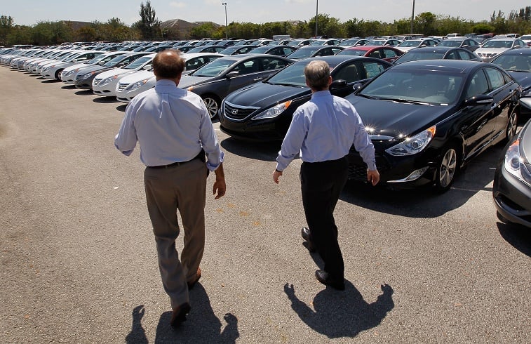 salesmen in a car lot