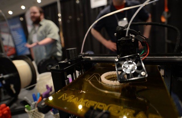 A 3D printer prints an object, during 'Inside 3D Printing' conference and exhibition in New York, April 22, 2013. The exhibition features on April 22-23, 2013, tutorials and seminars offering blueprints on how to invest and utilize 3D printing in coming years, as well as leading manufacturers and developers displaying their latest 3D printers and services. (Photo by Emmanuel Dunand/AFP/Getty Images)