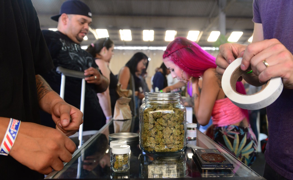 Card-carrying medical marijuana patients attend Los Angeles' first-ever cannabis farmer's market at the West Coast Collective medical marijuana dispensary, on the fourth of July, or Independence Day, in Los Angeles, California on July 4, 2014 where organizer's of the 3-day event plan to showcase high quality cannabis from growers and vendors throughout the state. (Photo by Frederic J. Brown/AFP/Getty Images)