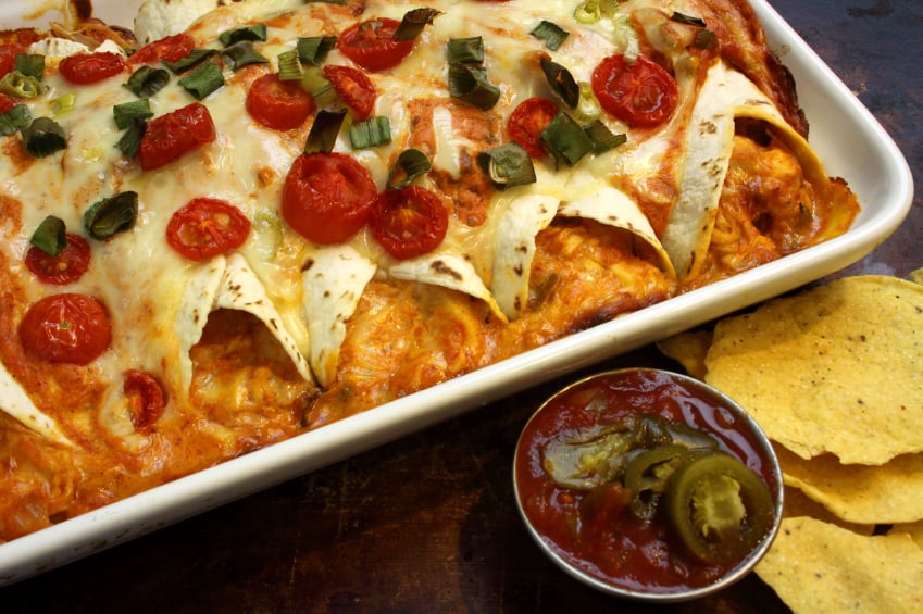 Chicken enchiladas with cheese and tomatoes