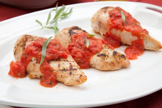 chicken topped with tomato sauce