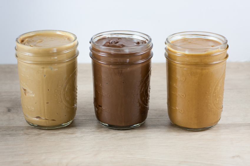 three jars of homemade peanut butters