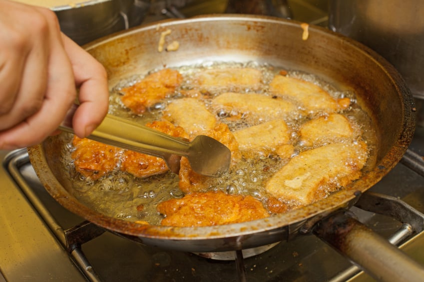 Tofu pieces being deep fried