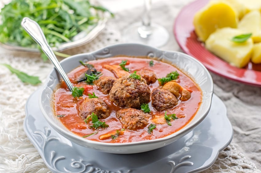Meatball soup in a tomato broth