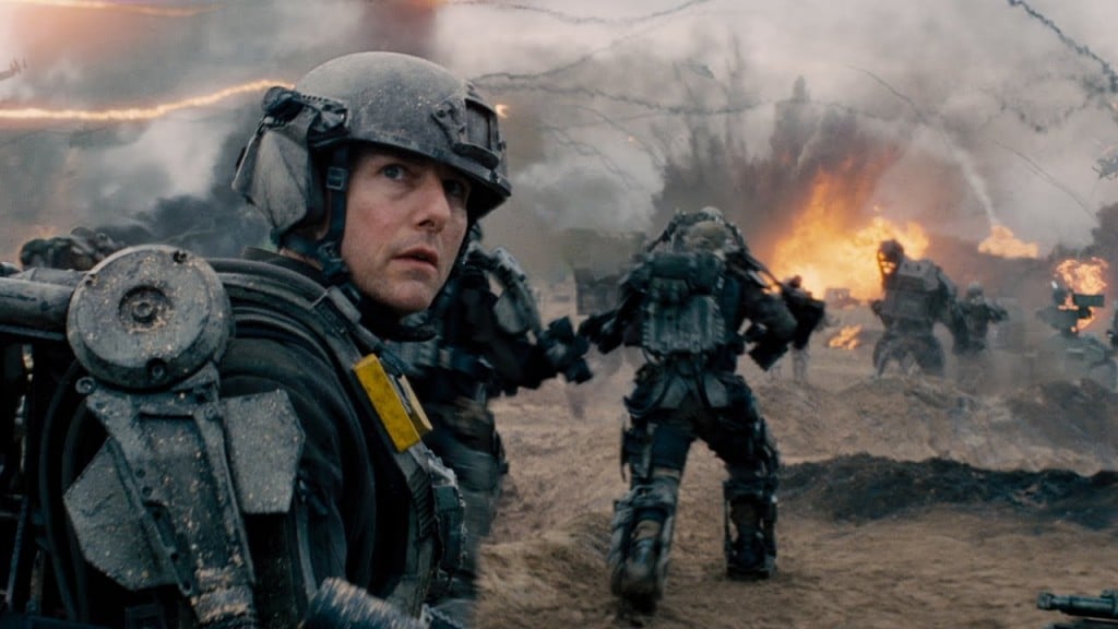 Tom Cruise wears a helmet and armor while in battle in Edge of Tomorrow