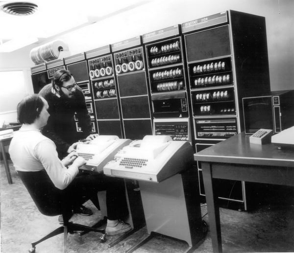 Ken Thompson and Dennis Ritchie (standing) at Bell Labs