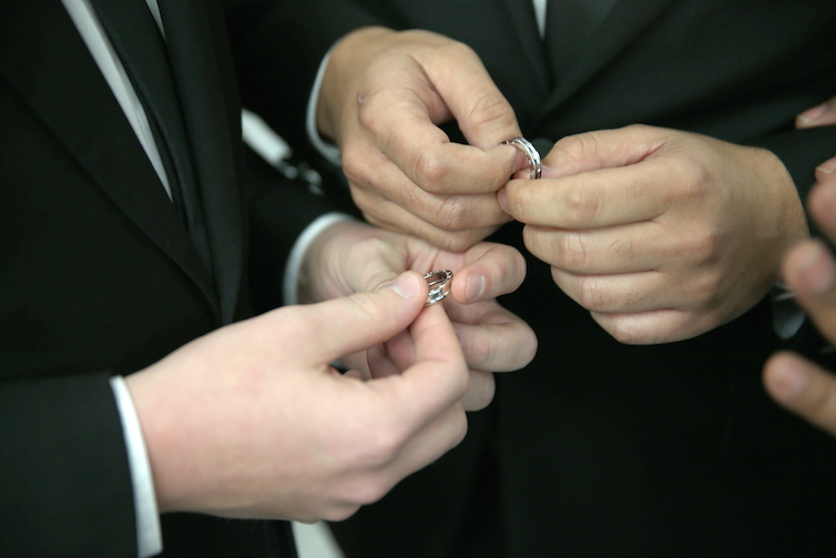 Couple exchanging rings