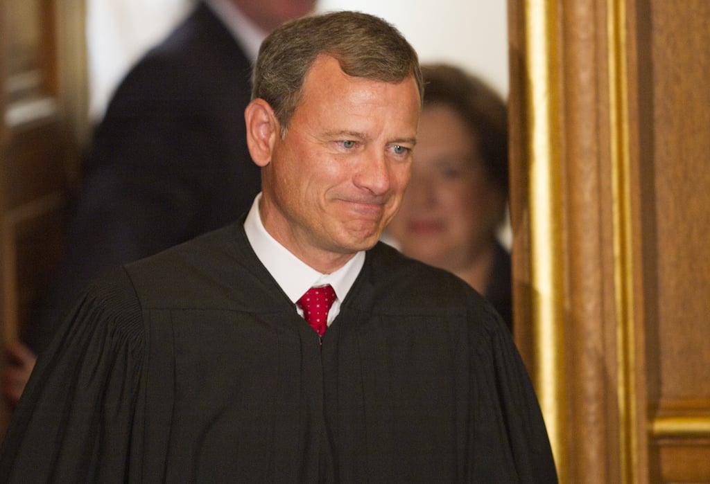 US Supreme Court Chief Justice John Roberts is followed by Elena Kagan on her way to take the Judicial Oath to become the 112th US Supreme Court justice, and only the 4th woman to take the job, at the West Conference room of the Supreme Court in Washington on August 7, 2010. Senators voted 63-37 on August 5 to confirm Kagan as one of the nine justices who act as final arbiters of the US Constitution, set precedent for lower courts, and decide the nation's toughest moral and legal dilemmas. Photo by Paul J. Richards/AFP/Getty Images