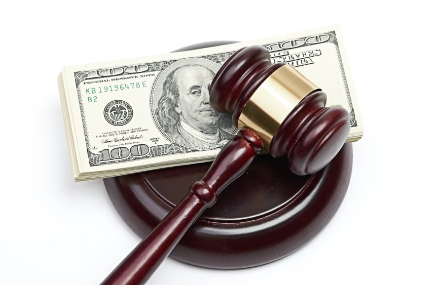 A gavel and cash