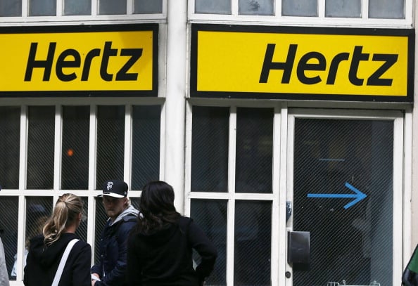 Customers outside of a Hertz location