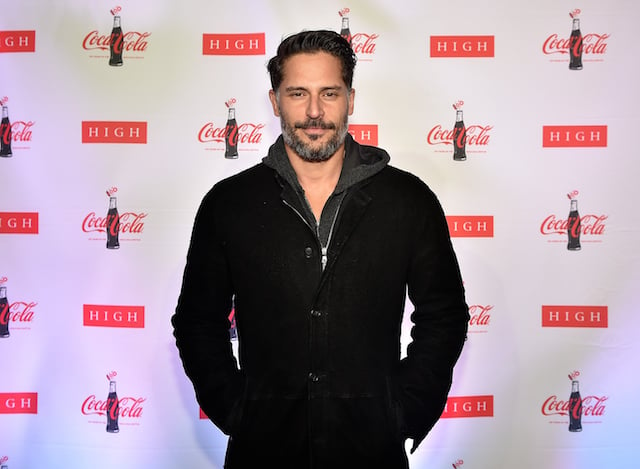 Joe Manganiello poses on the red carpet with his hands in his pockets.
