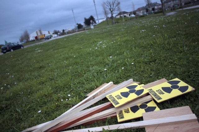 Placards reading "Stop Plutonium" are pictured - Source: Charly Triballeau/AFP/Getty Images
