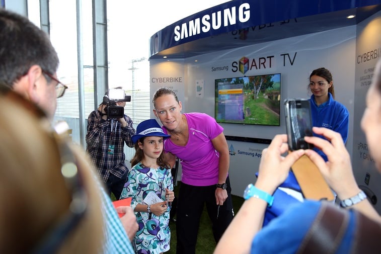 People visit the Samsung stand and takes part in a cycle game during the Mutua Madrid Open - Source: Julian Finney/Getty Images