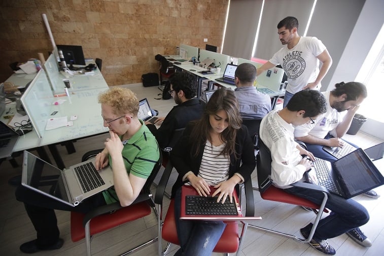 entrepreneurs from different internet start-up companies work in the offices of "accelerator" Seeqnce in Beirut's Hamra district, on April 24, 2013. Lebanon, a country plagued for years by slow internet and crumbling infrastructure, is seeing a new interest in internet start-ups. Young Lebanese inspired by Western tales of start-up success, including Facebook, are taking advantage of projects intended to guide their budding businesses, as well as innovative loan models to help them finance their dreams. entrepreneurs from different internet start-up companies work in the offices of "accelerator" Seeqnce in Beirut's Hamra district, on April 24, 2013. Lebanon, a country plagued for years by slow internet and crumbling infrastructure, is seeing a new interest in internet start-ups. Young Lebanese inspired by Western tales of start-up success, including Facebook, are taking advantage of projects intended to guide their budding businesses