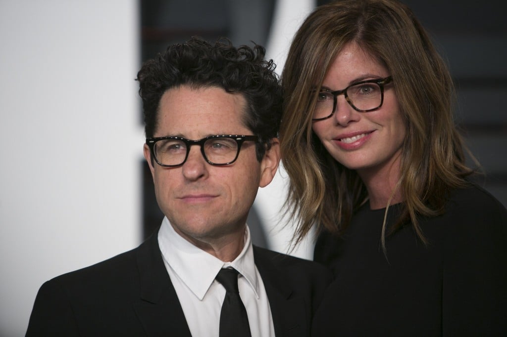 Director J.J. Abrams with his wife, posing on the red carpet Director J.J. Abrams with his wife, posing on the red carpet