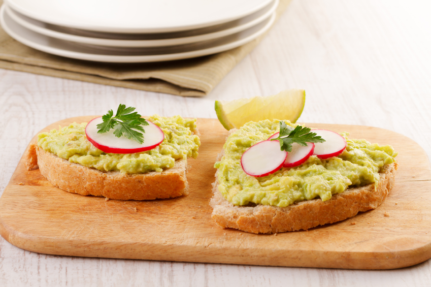 Mashed avocado on toast with veggies. Mashed avocado on toast with veggies.