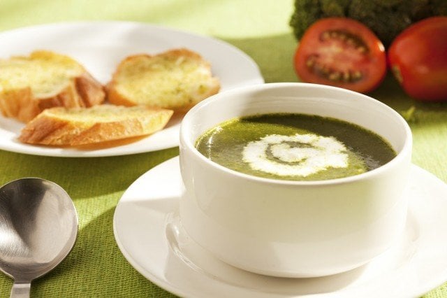 A healthy herbed soup served with croutons