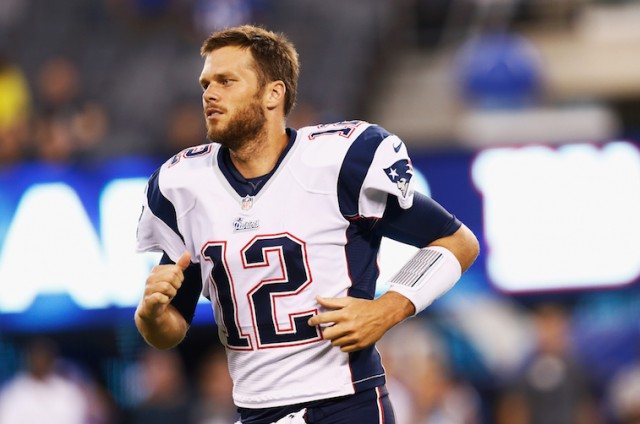Tom Brady running on football field Tom Brady running on football field