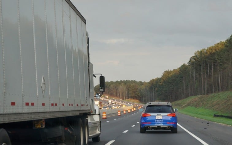 The self-driving Delphi Audi passes a semi on its autonomous trip from California to New York in 2015