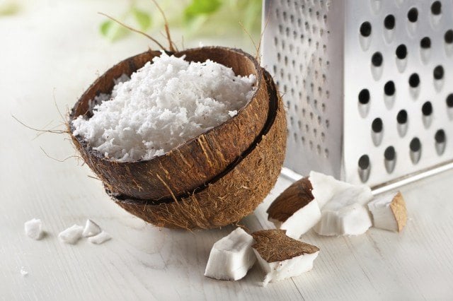 coconut grated in a coconut shell coconut grated in a coconut shell