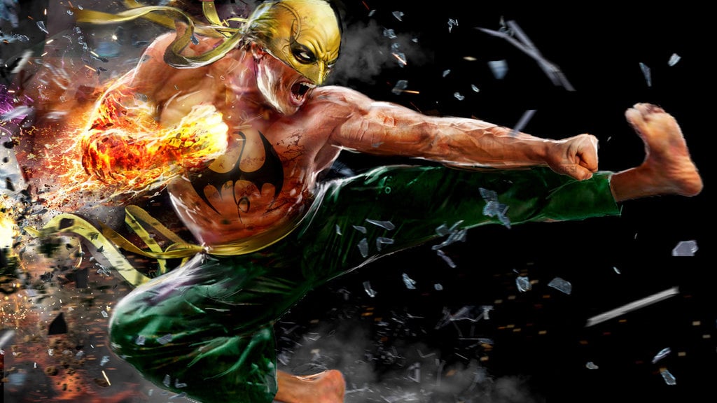 Iron Fist in full costume and with glowing hand about to deliver a blow