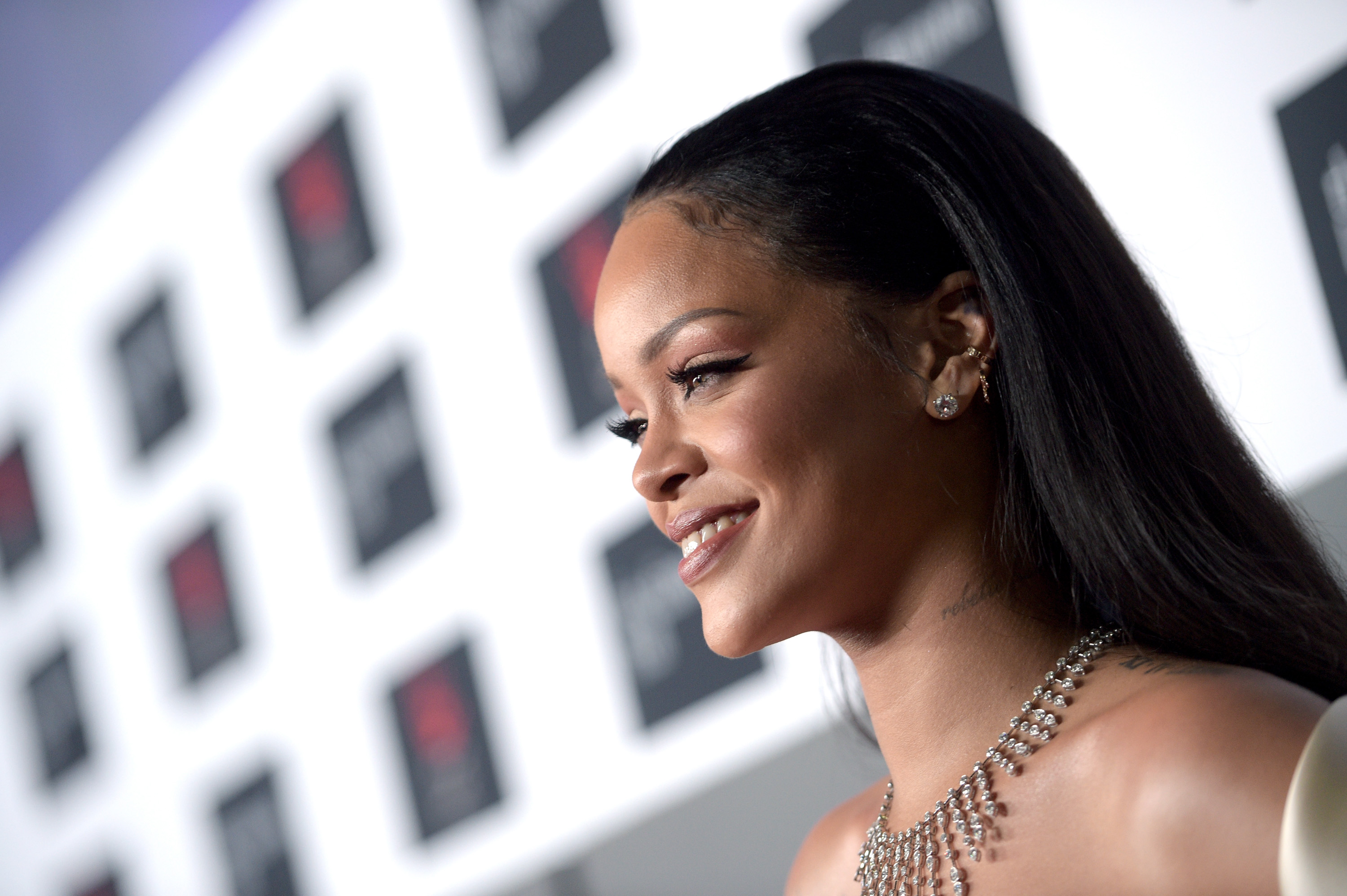 Rihanna smiling on the red carpet