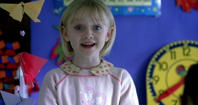 Young Dakota Fanning smiles in a scene from I Am Sam
