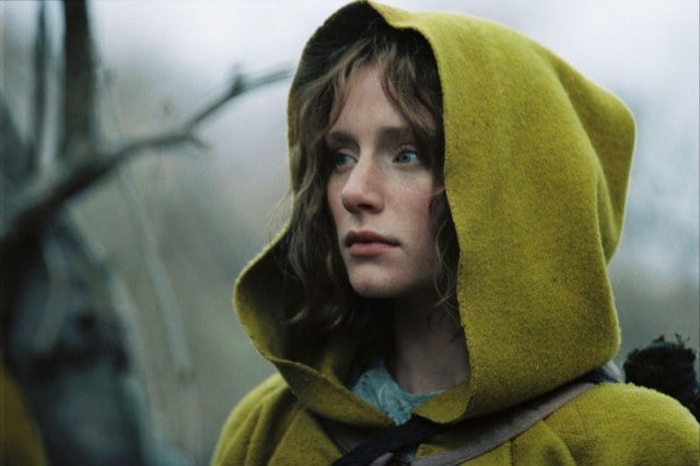 Bryce Dallas Howard wears a yellow hooded cape in a scene from The Village