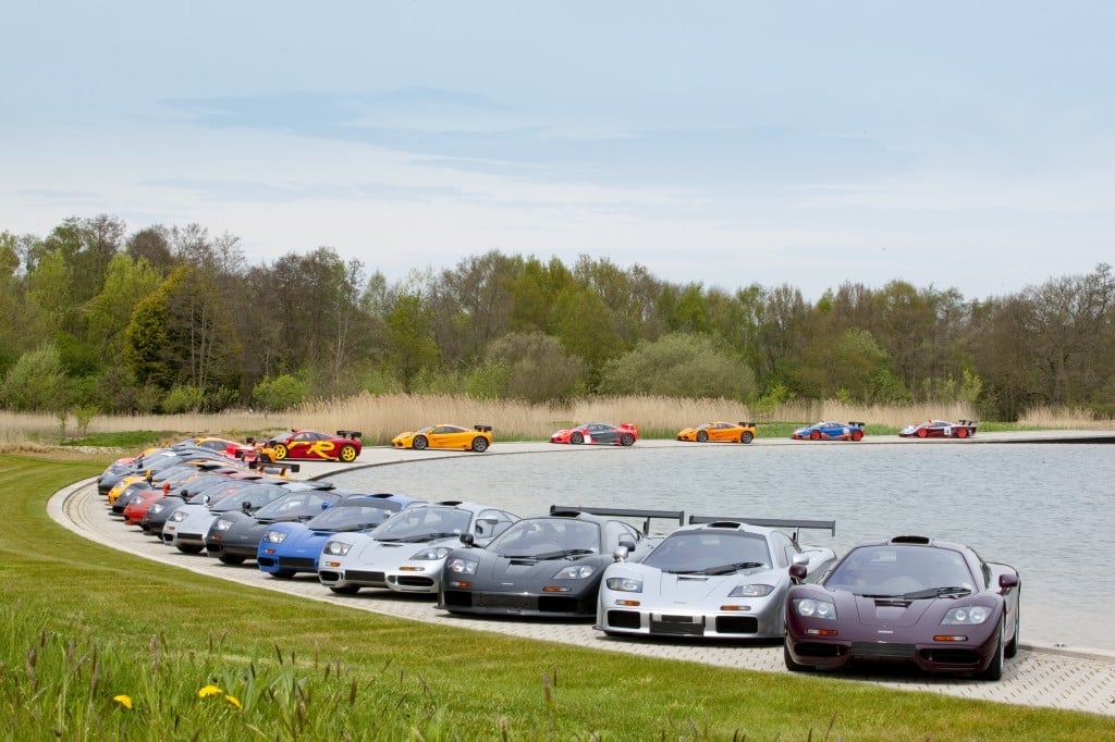 McLaren F1s parked around the edge of a pond at the McLaren Technical Center