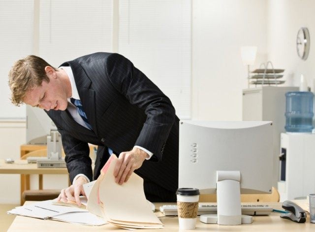Man looking for files Man looking for files