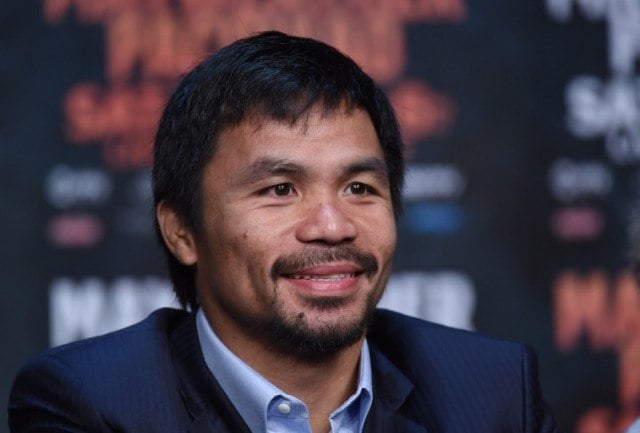 Manny Pacquiao smiles during a media event Manny Pacquiao smiles during a media event
