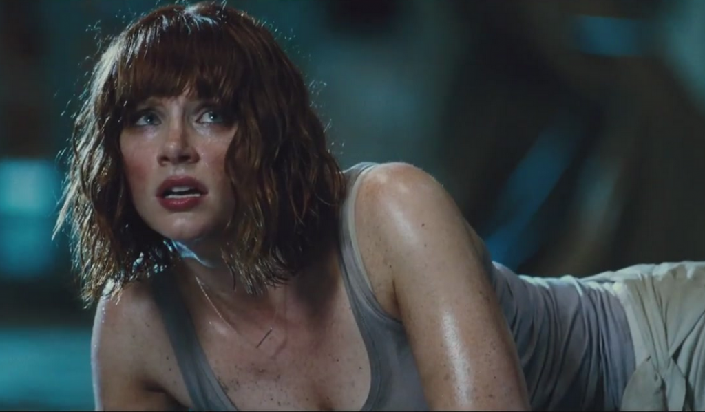 Bryce Dallas Howard lays on the ground in Jurassic World 