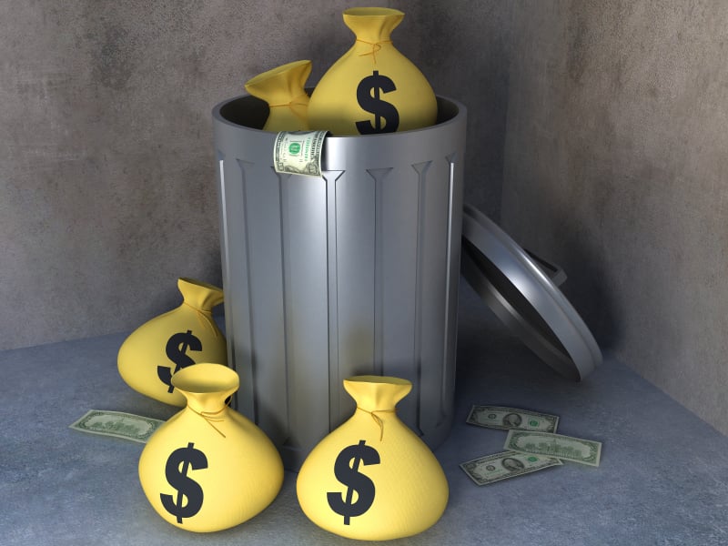 trashcan with money