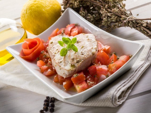 Tuna steak with fresh herbs and tomatoes