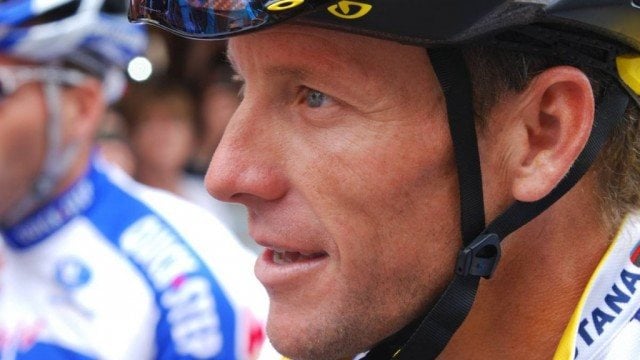 Cyclist Lance Armstrong wearing a helmet 