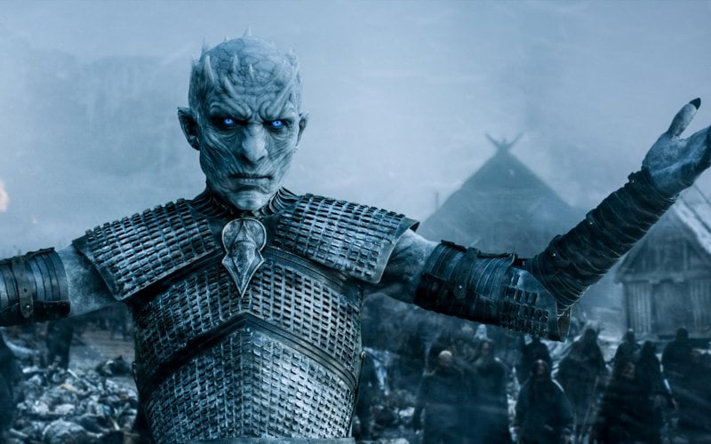 The Night King stands in the snow with his arms stretched out. The Night King stands in the snow with his arms stretched out.