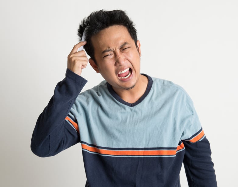 a man brushing his hair